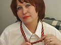 Plump brunette granny slowly stripping off her clothes to unleash her massive sagged breasts